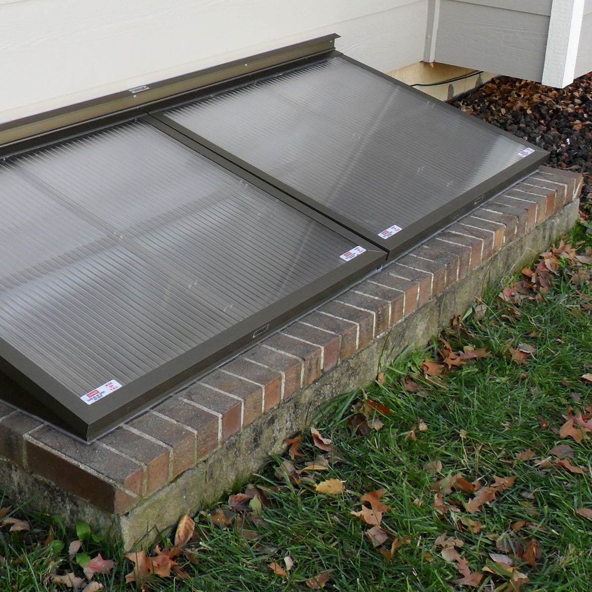Egress window well covers built by Lustercraft