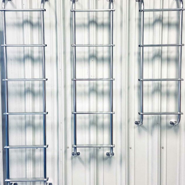 Egress window well escape ladders